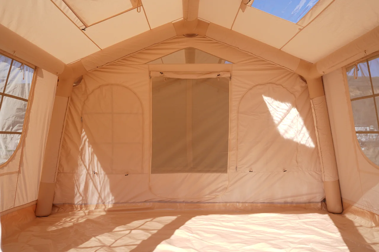 Open interior of a beige 17.28 square metre inflatable lodge
