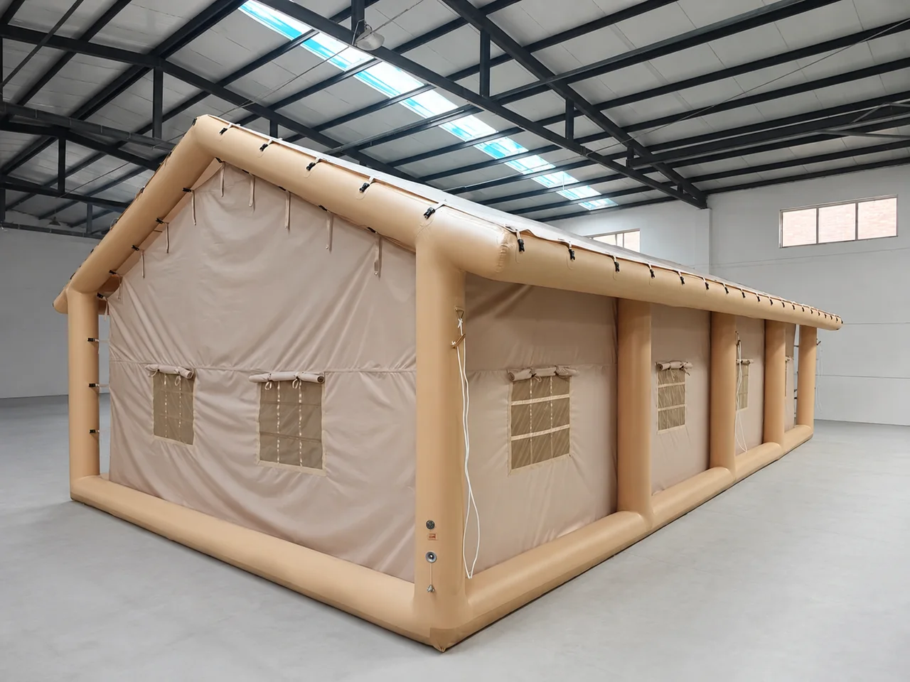 Inflatable Majlis-style camping tent viewed from the rear corner in a workshop