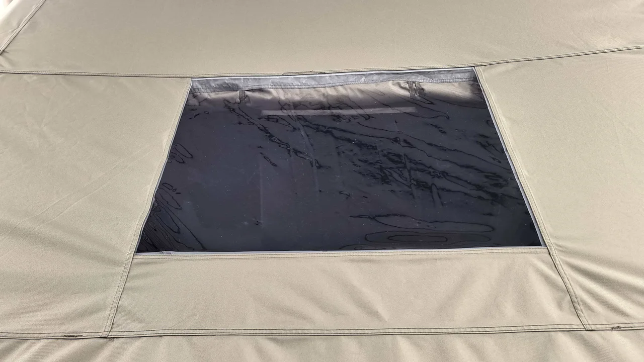 Clear side window panel and stitched cover on an LT-12 inflatable cabin tent