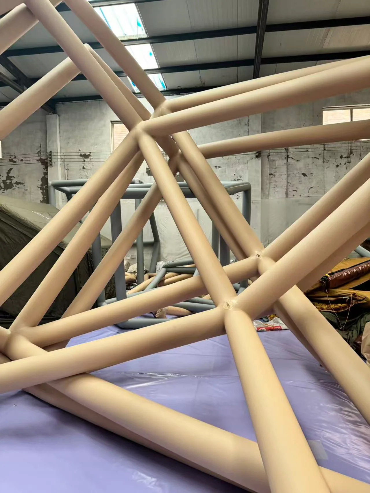 Assembled inflatable tent air-beam frame inside the workshop