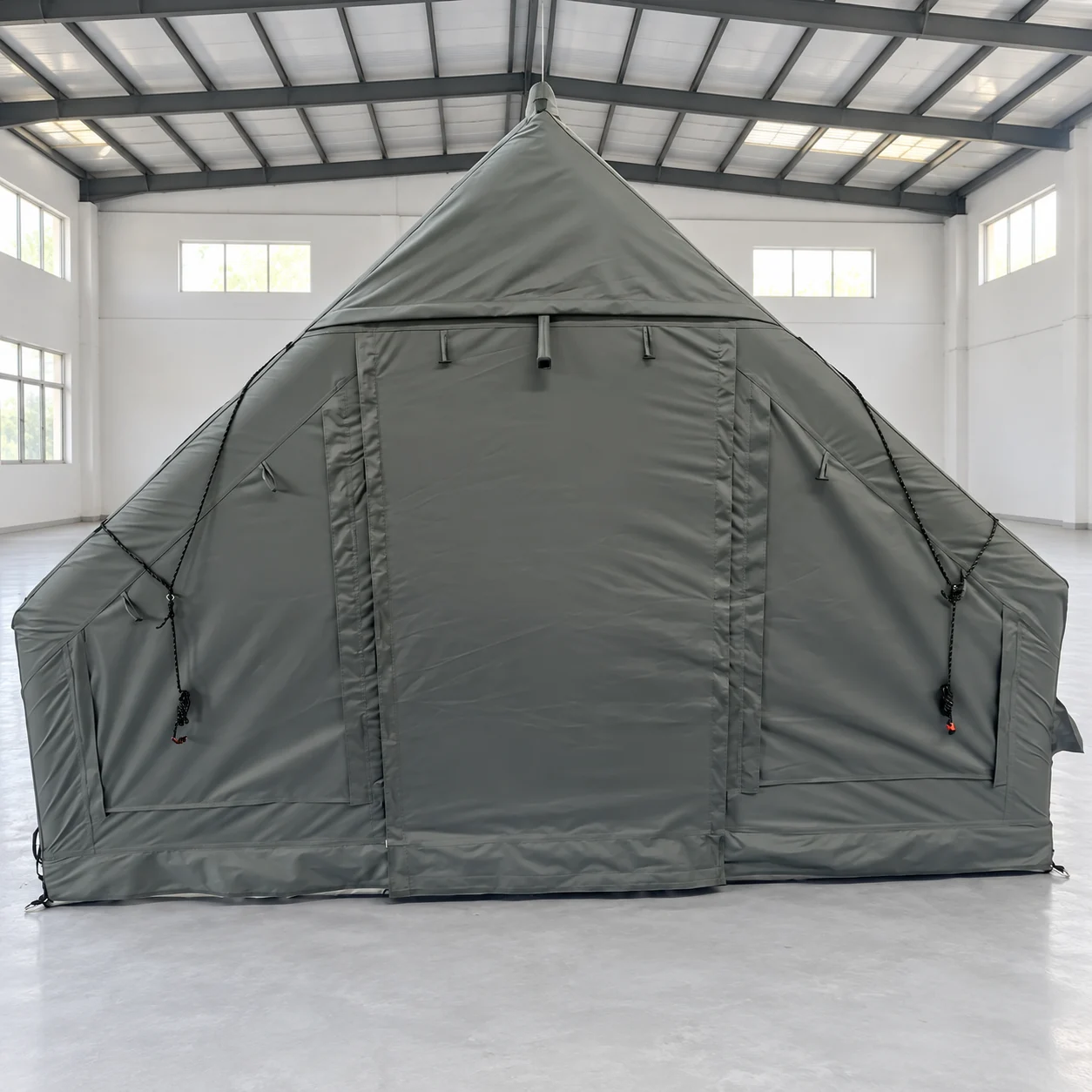 Gray LT-12 inflatable family camping tent set up in a clean workshop